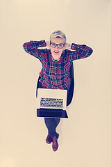 Image showing top view of young business woman working on laptop computer