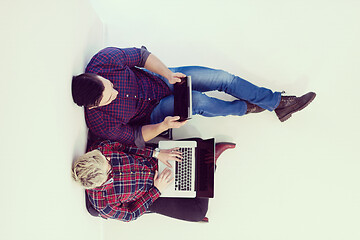 Image showing top view of  couple working on laptop computer at startup office