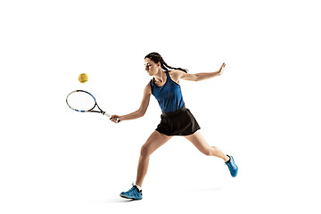 Image showing Full length portrait of young woman playing tennis isolated on white background