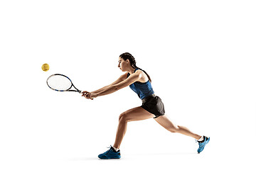 Image showing Full length portrait of young woman playing tennis isolated on white background