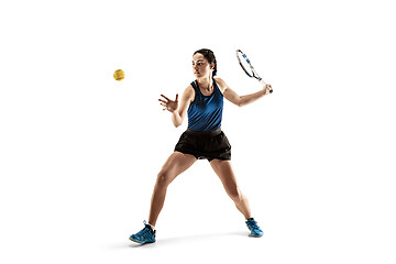 Image showing Full length portrait of young woman playing tennis isolated on white background