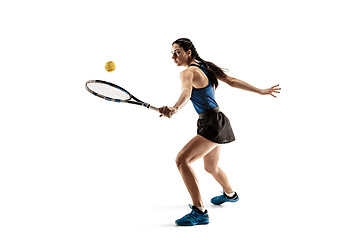 Image showing Full length portrait of young woman playing tennis isolated on white background