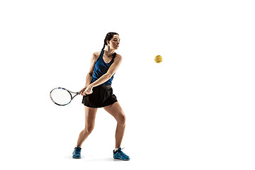 Image showing Full length portrait of young woman playing tennis isolated on white background