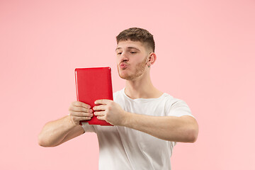 Image showing Businessman hugging laptop