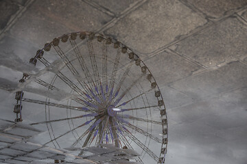 Image showing Reflection of a Ferris Wheel in Puddle on Sidewalk of Paris, France