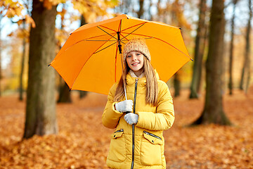 Image showing happy girl with umbrella at autumn park