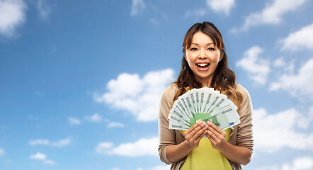 Image showing asian woman with hundred euro money banknotes