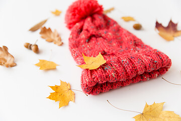 Image showing hat and fallen autumn leaves on white background