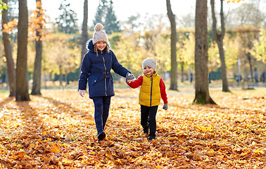 Image showing happy children walking at autumn park