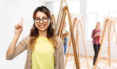 Image showing asian woman in glasses or student with finger up