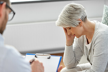 Image showing sad senior woman patient and psychologist