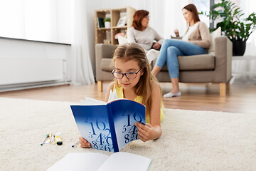 Image showing student girl with textbook learning at home