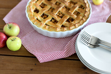 Image showing apple pie in baking mold on wooden table