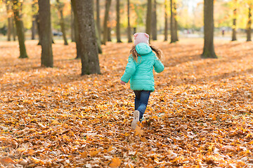 Image showing happy girl running in autumn park