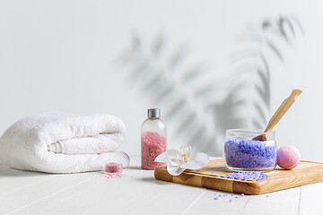 Image showing Beautiful spa composition on massage table in wellness center, copyspace, leaves\' shadow