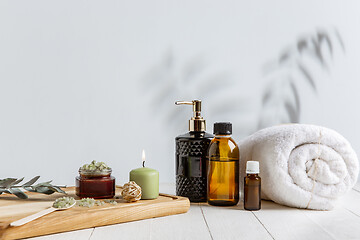 Image showing Beautiful spa composition on massage table in wellness center, copyspace, leaves\' shadow