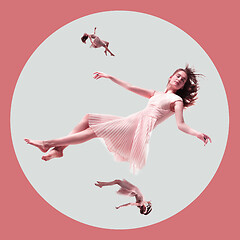 Image showing Mid-air beauty. Full length studio shot of attractive young woman hovering in air and keeping eyes closed