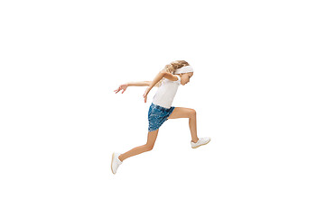 Image showing Happy little caucasian girl jumping and running isolated on white background