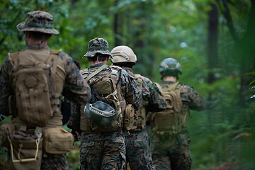 Image showing Modern warfare Soldiers  Squad  in battle