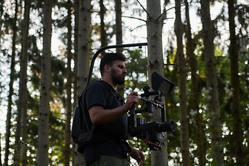 Image showing Videographer Taking Action Shoot of Soldiers in Action