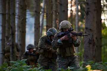 Image showing Modern warfare Soldiers  Squad  in battle