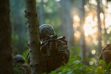 Image showing soldier in action aiming  on weapon  laser sight optics