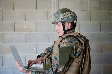 Image showing soldier using laptop computer