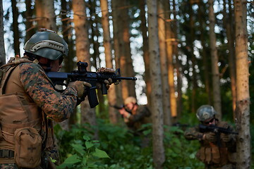 Image showing Modern warfare Soldiers  Squad  in battle