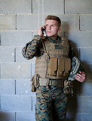 Image showing soldier using smartphone