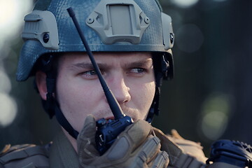 Image showing Officer Talking Portable Radio Station