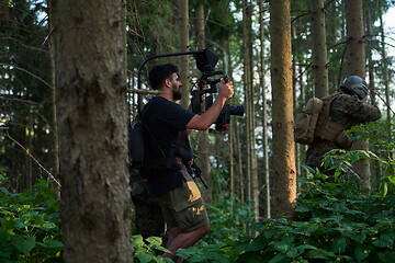 Image showing Videographer Taking Action Shoot of Soldiers in Action