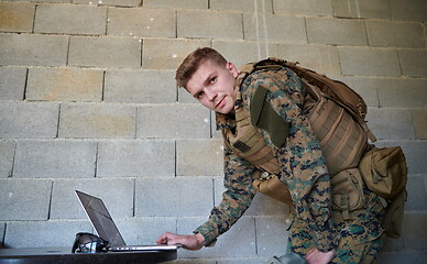 Image showing soldier using laptop computer