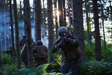 Image showing Modern warfare Soldiers  Squad  in battle