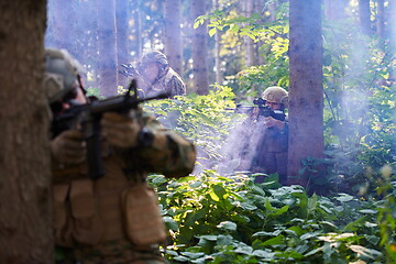 Image showing Modern warfare Soldiers  Squad  in battle