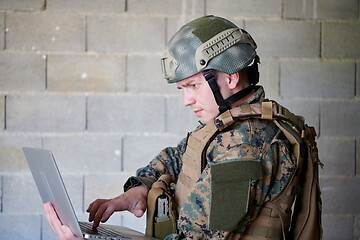 Image showing soldier using laptop computer