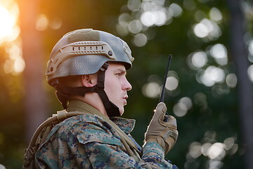 Image showing Officer Talking Portable Radio Station