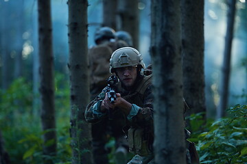 Image showing Modern warfare Soldiers  Squad  in battle