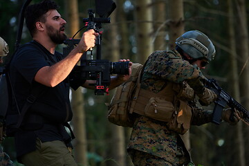 Image showing Videographer Taking Action Shoot of Soldiers in Action