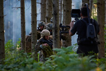 Image showing Videographer Taking Action Shoot of Soldiers in Action