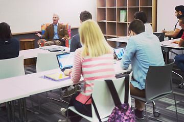 Image showing teacher with a group of students in classroom