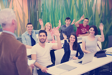 Image showing teacher with a group of students in classroom