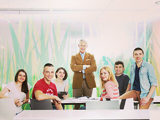 Image showing portrait of in teacher in classroom with students group in backg