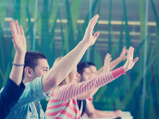 Image showing students group raise hands up on class