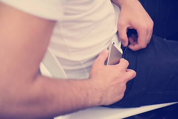 Image showing putting phone in pocket