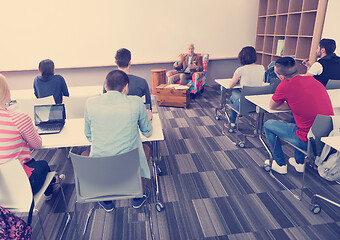 Image showing teacher with a group of students in classroom