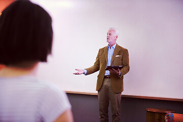 Image showing teacher with a group of students in classroom