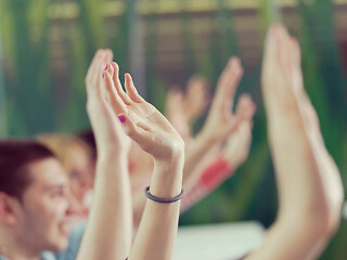 Image showing students group raise hands up on class