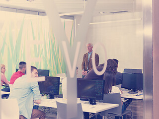 Image showing senior teacher and students group in computer lab classroom