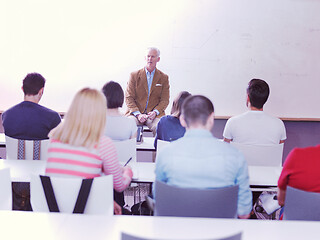 Image showing teacher with a group of students in classroom