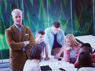 Image showing teacher with a group of students in classroom